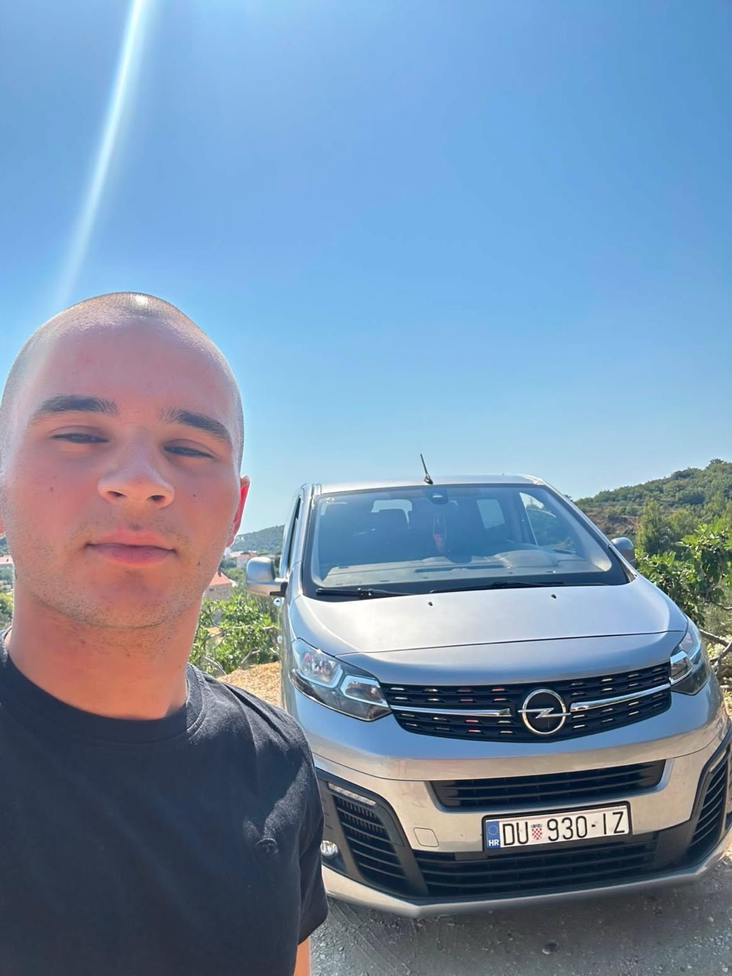 Marin, one of our drivers, with his van above Cavtat